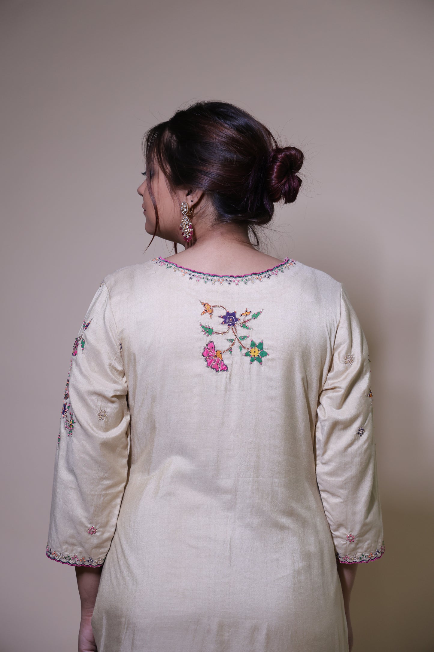 Beige handpainted floral kurta with silk pallazzo suit with intricate dori & beads handwork