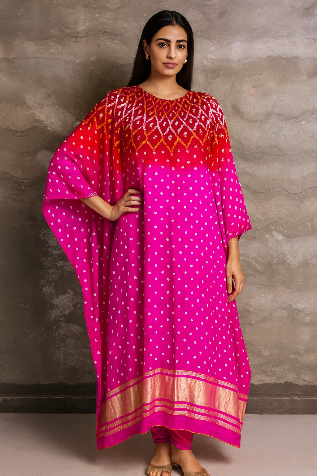 Woman wearing a pink and red patterned dress against a grey background Pink silk bandhej Kaftaan with zari work