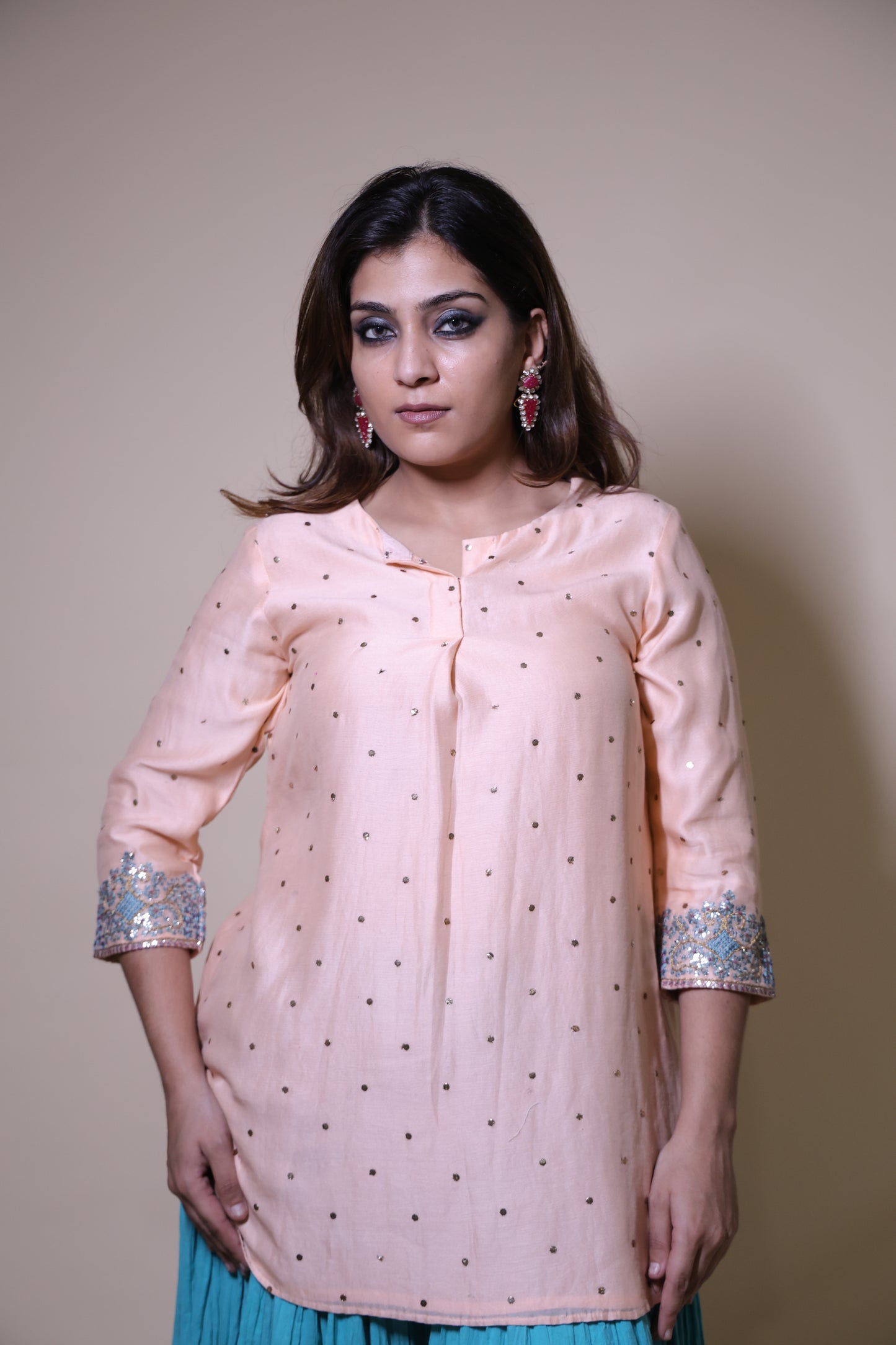 Peach mukaish short kurta with crushed skirt with gotta patti work
