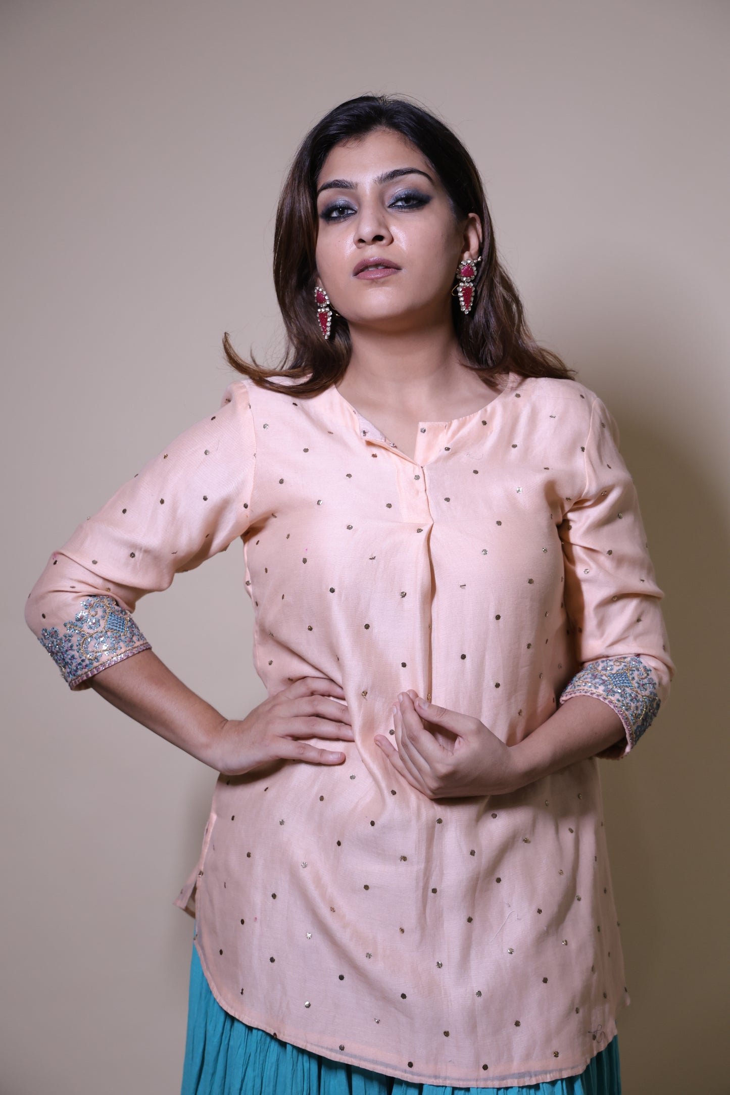 Peach mukaish short kurta with crushed skirt with gotta patti work
