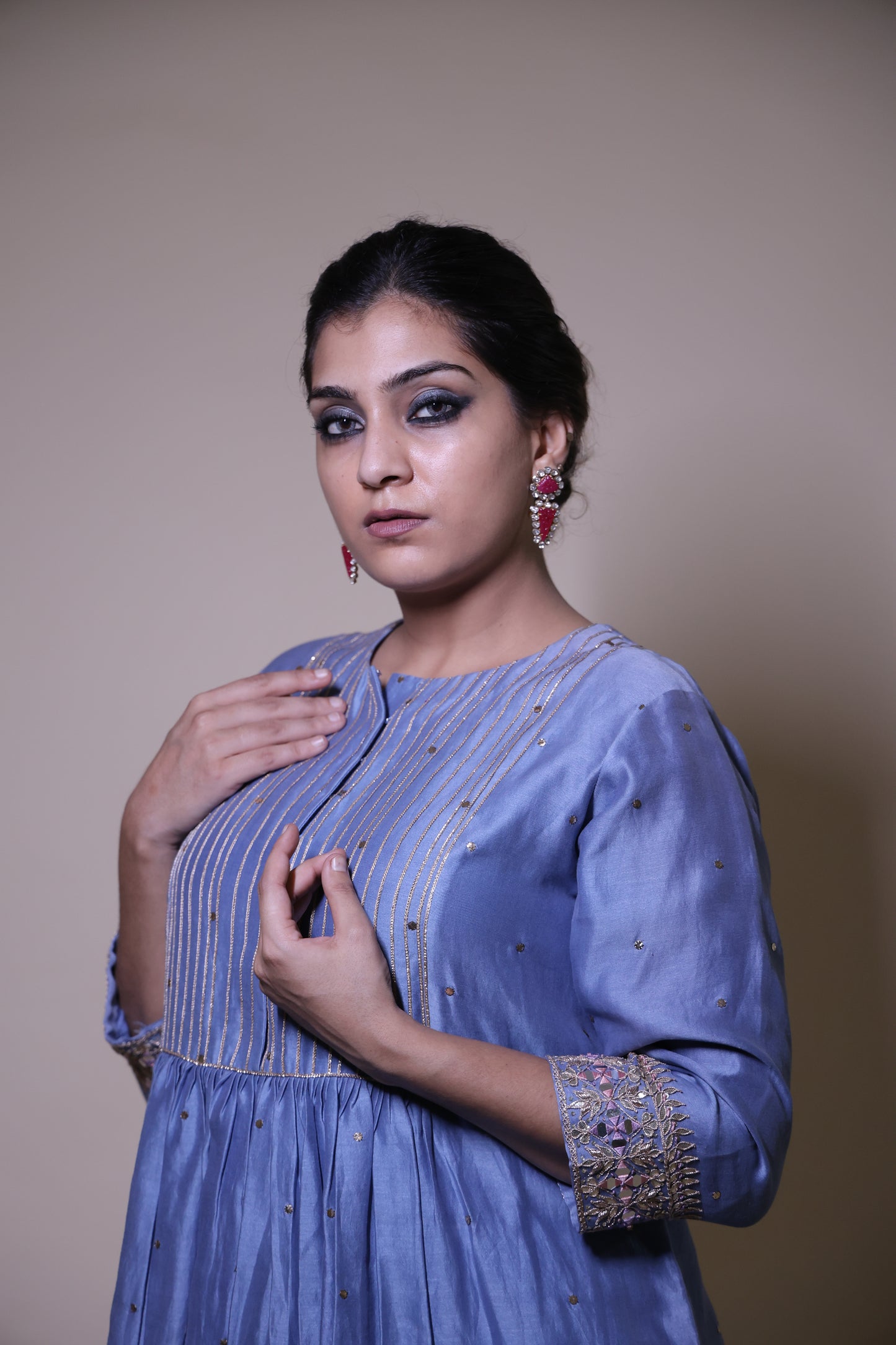 Blue mukaish short kurta with  cream tissue pants