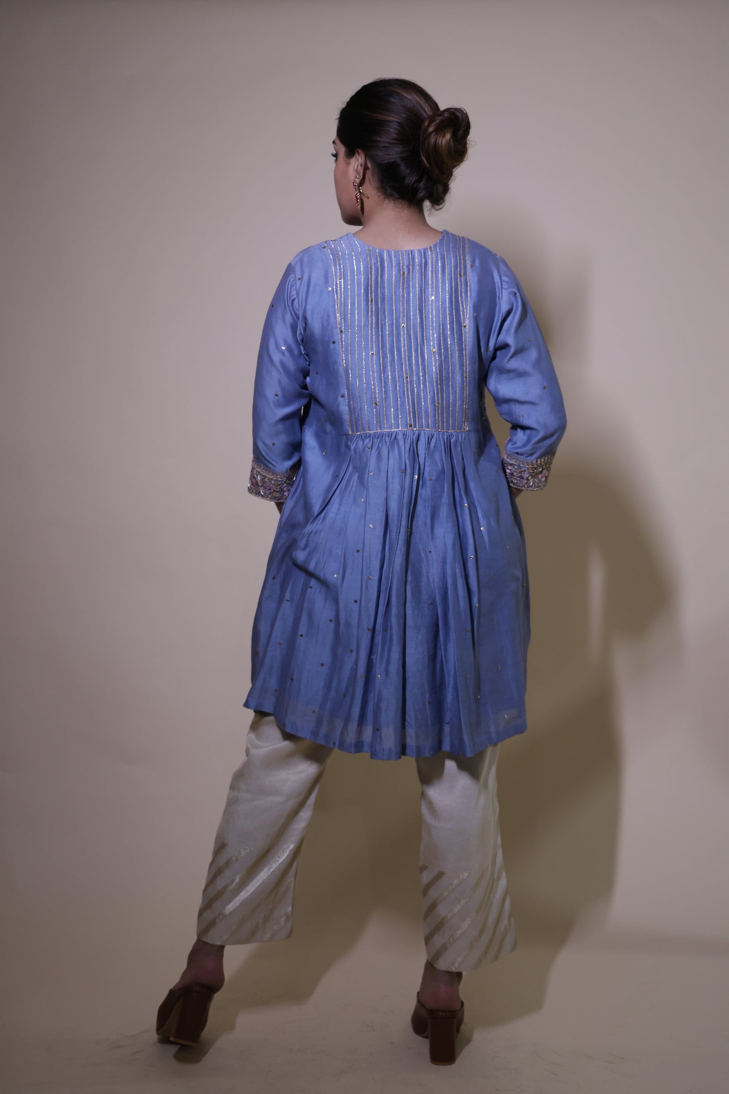 Blue mukaish short kurta with  cream tissue pants