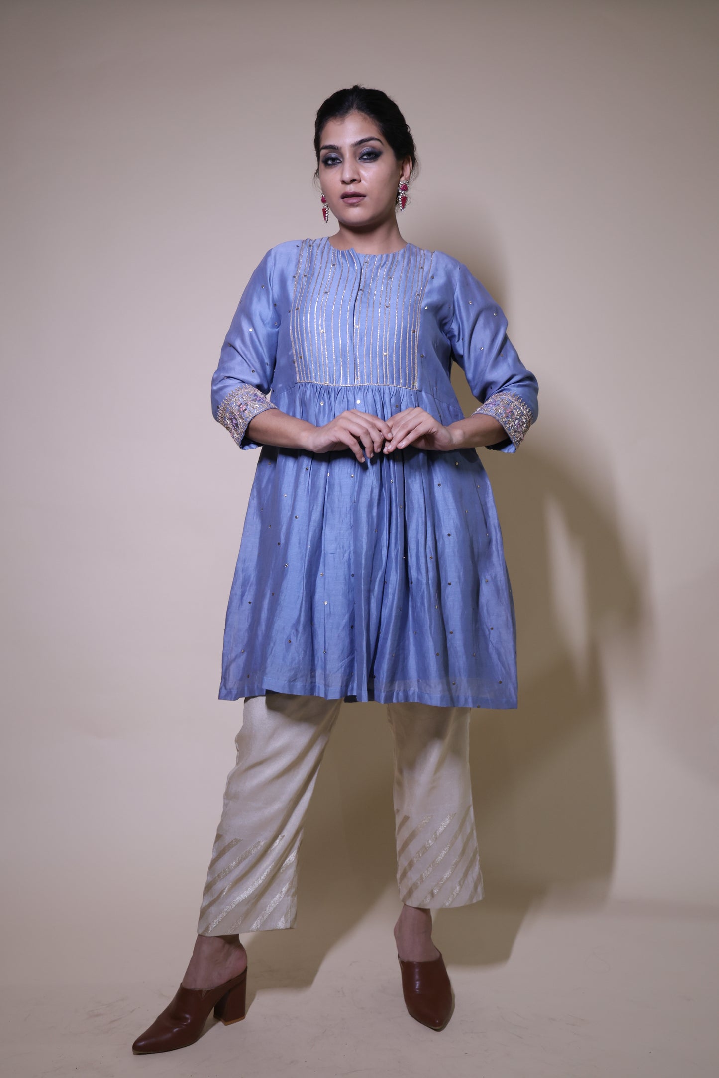 Blue mukaish short kurta with  cream tissue pants
