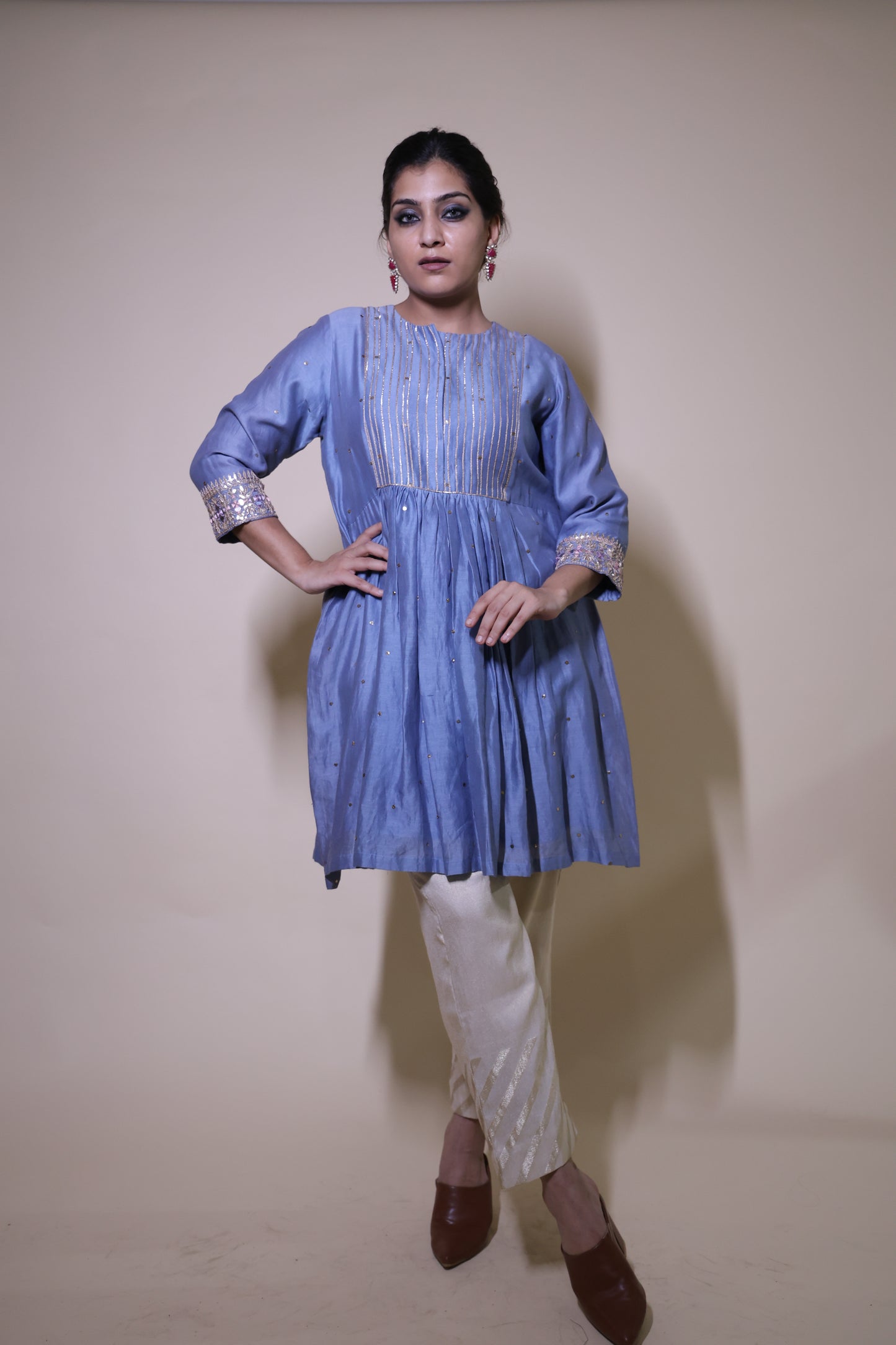 Blue mukaish short kurta with  cream tissue pants