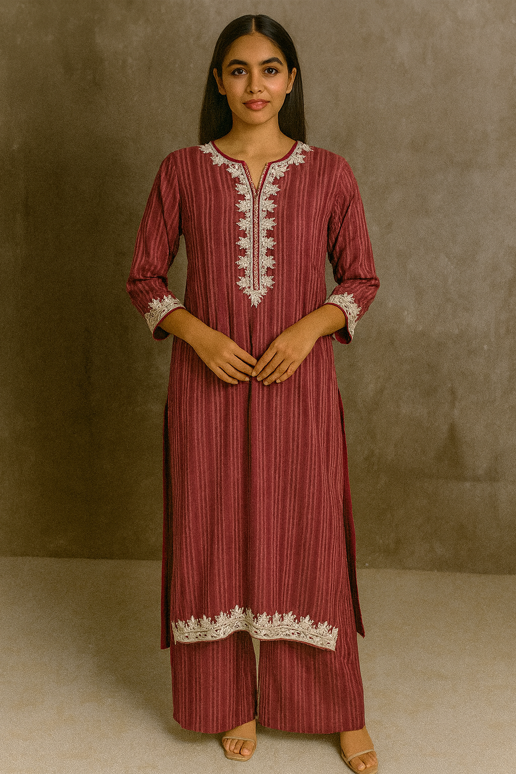 Woman wearing a red striped dress with white embroidery against a neutral background Maroon &amp; Red Cotton Kurta Set with Dori Marodi